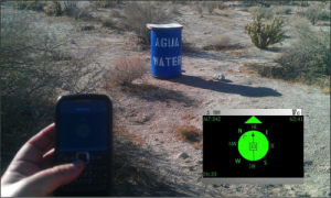Figure 1. The Transborder Immigrant Tool’s compass rose provides directions to a Water Station Inc. water cache in the Anza-Borrego Desert. The screenshot is captured from the same Nokia e71 mobile phone featured here. (Photo: Brett Stalbaum. Courtesy of the artist.)