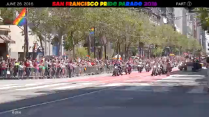 Fig. 4. San Francisco Pride Parade - Dykes on Bikes®. source: Party Of The Third Part. SF Pride Parade 2016, Part 1: Dykes on Bikes, Motorcyclists, Bicyclists, and a Truck. N.p. Film. https://www.youtube.com/watch?v=2Uid4_jy6zo. A distant image of the motorcycles at the start of a pride parade.