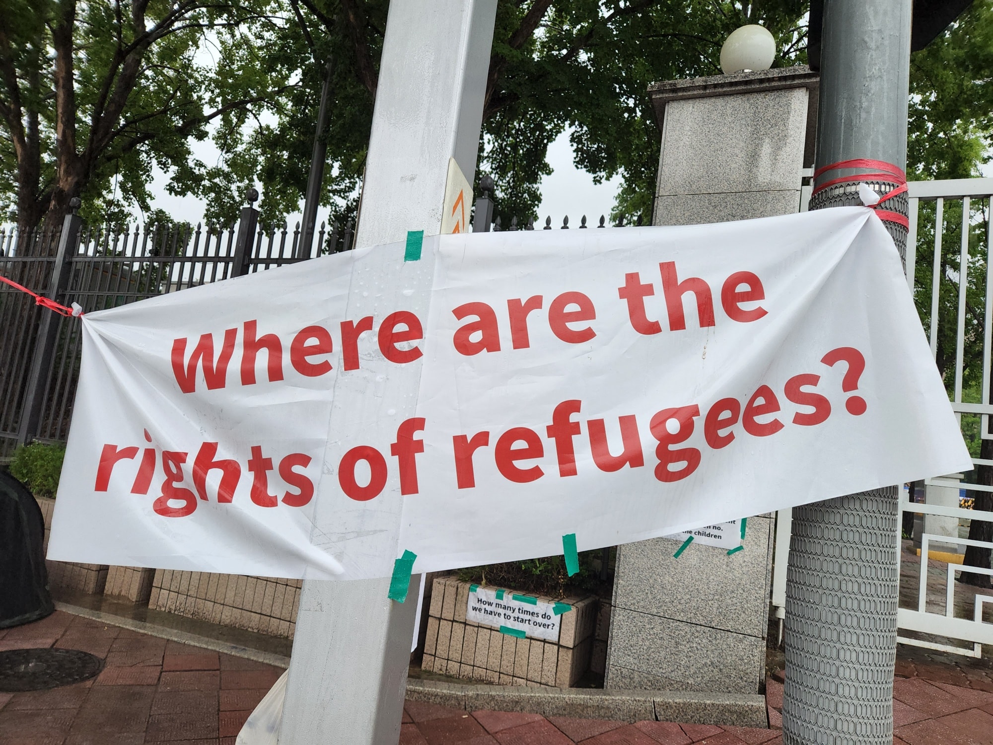 A banner, which says "Where are the rights of refugees?" in English in red, is hung by the NANCEN Refugee Rights Center's colleagues at the hunger strike space of a refugee family.