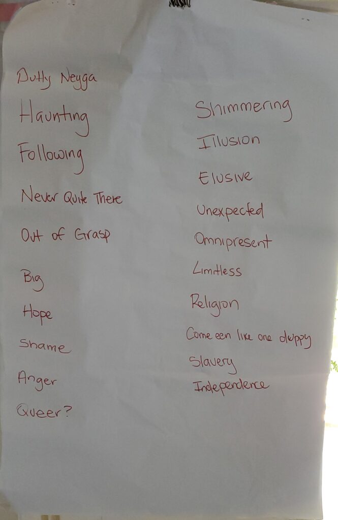 an image of white flipchart paper with red writing. 