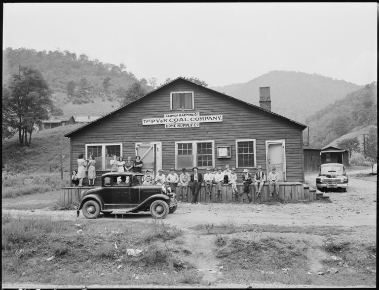 Photo of mining families standing in front of company store