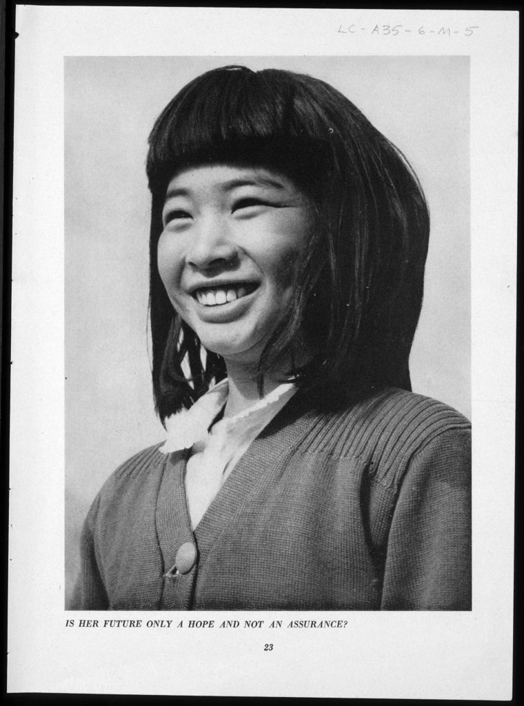 A portrait of a young Japanese American girl. A young smiling Japanese American girl facing left at a ¾ view