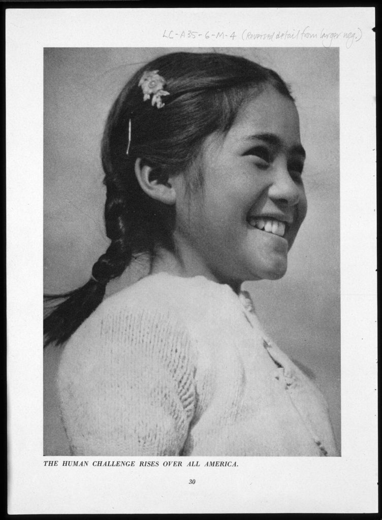 A portrait of a young Japanese American girl. A young smiling interned Japanese American girl facing right at a 2/3 view.