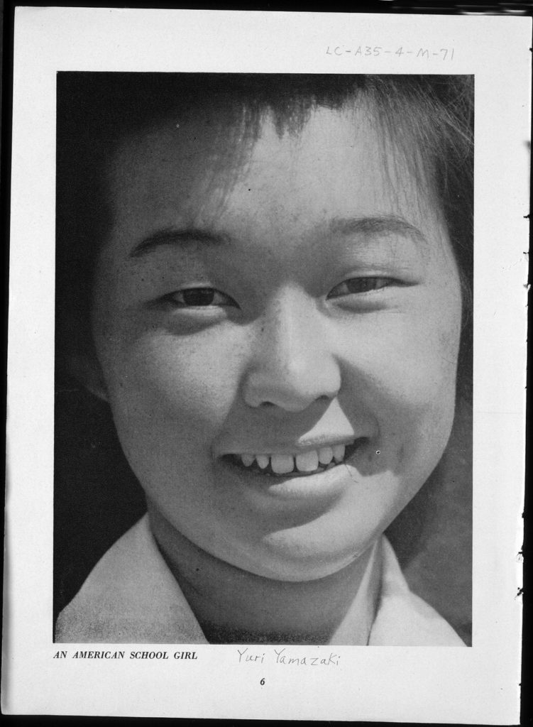 A close-up front view portrait of Yuri Yamazaki, a young Japanese American girl.