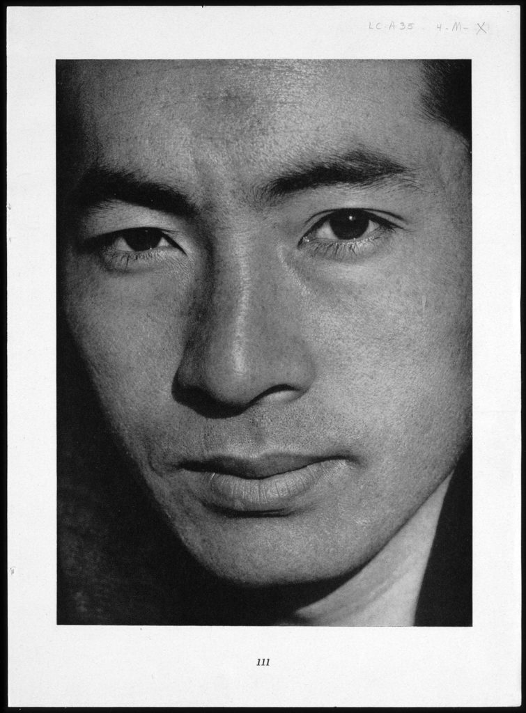  A close-up front view portrait of Yuichi Hirata, a young Japanese American man.
