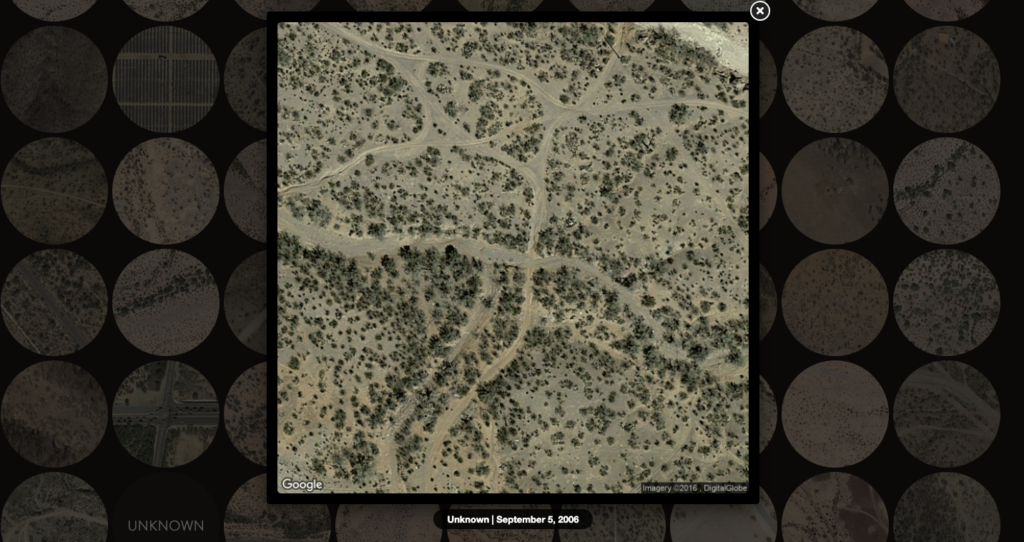 The image shows a close-up version of one of the circles in "Fatal Migrations". It shows a cross-roads in the dirt with "Unknown" and the date of September 5, 2006 right after.