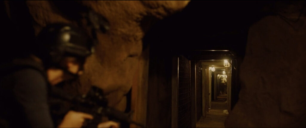 Scene from Sicario. Kate looking down a tunnel.