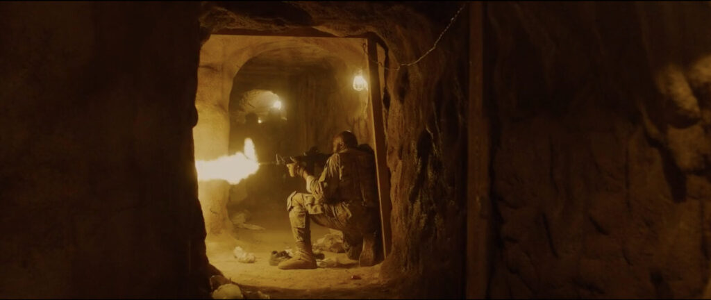 Scene from Sicario. Soldiers shooting inside the tunnel.