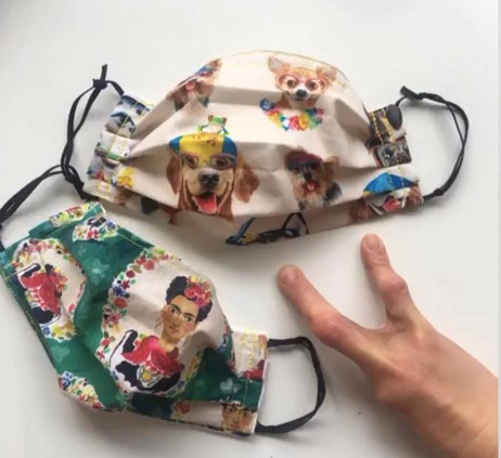 One mask has funny dog prints and the other has Frida Kahlo’s portrait