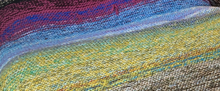 Photo of knitted fabric in gradient colors