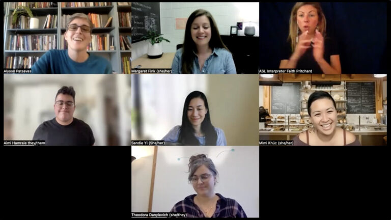 Screenshot from the video roundtable conversation featuring 7 people's Zoom boxes, all in various states of smiling. Article includes more detailed description of participants and Zoom backgrounds.
