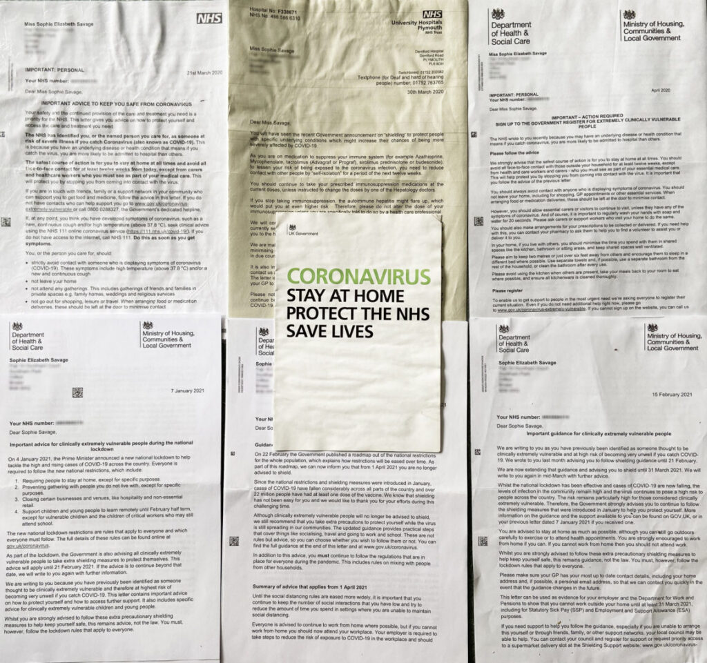 Photo of a collage of shielding letters with a leaflet in the centre. Photograph of six letters from the department of health and social care and the NHS. There is a white leaflet in the centre from the UK government, which says coronavirus, stay at home, protect the NHS, safe lives. The letters are addressed to Sophie Elizabeth Savage.