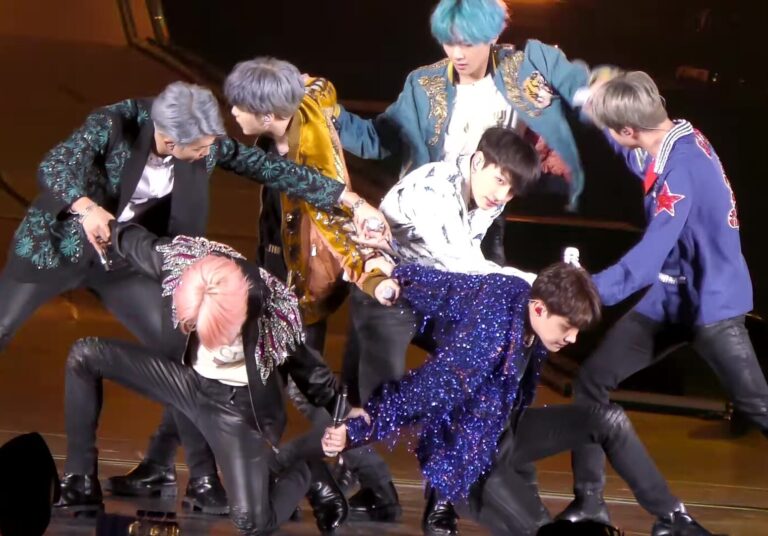 Seven BTS singers in a dance formation