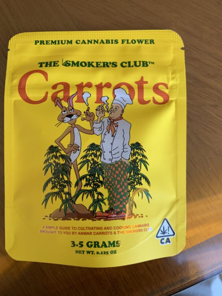 Cannabis package for the “Carrots” strain depicting a giant cartoon rabbit holding aloft a smoking joint and standing next to a man wearing a white chef’s hat, who also holds up a joint while exhaling clouds of smoke.