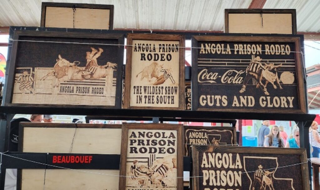 Intricate pyrography (wood-burned artwork) illustrating various scenes of competition and activity from the Angola Prison Rodeo.