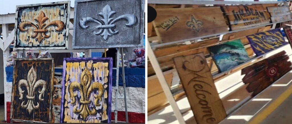 Detail of handcrafted wooden carvings and plaques featuring the Louisiana fleur-de-lis and various colorful decorative motifs.
